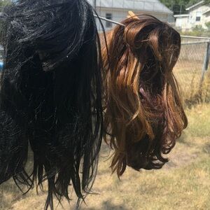 Used Halloween or costume props wigs. Black and light brown with highlights